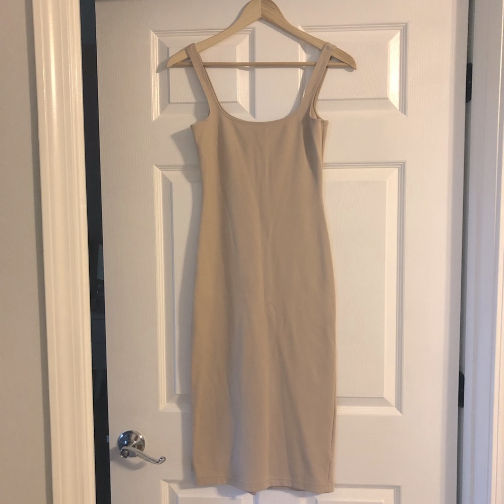 Sexy, curve hugging dress with back slit